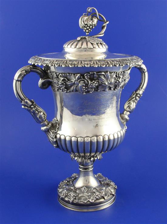 A William IV demi-fluted silver two handled presentation cup and cover by Matthew Boulton, weighted.